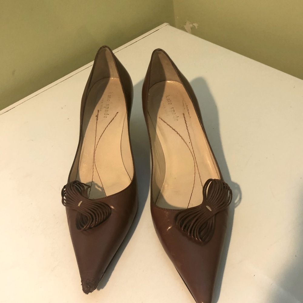KATE SPADE gently worn but as indicated in picture the tip has a scare